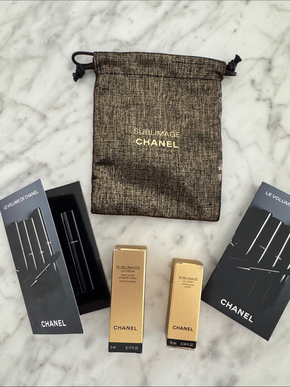 CHANEL Sublimage Gold Drawstring Pouch with mascara, lotion and cream